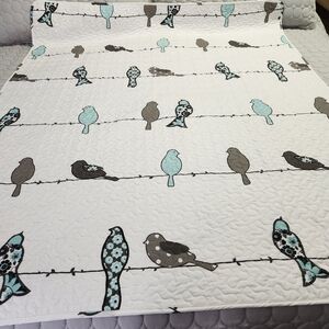 Lush White and Blue Bird Patterned Quilt